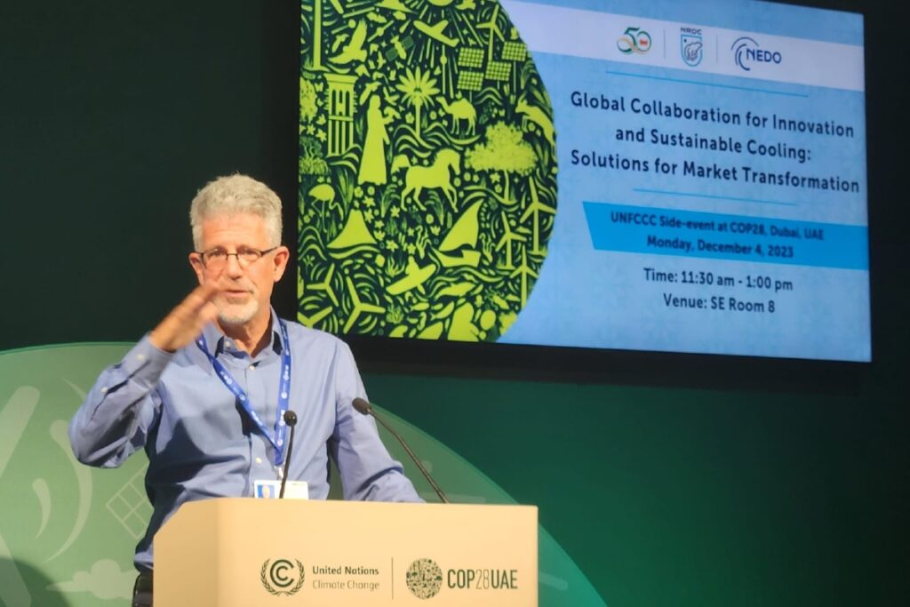 CCC Director Noah Horowitz on stage at an official COP28 side event hosted by NRDC, TERI, and NEDO.