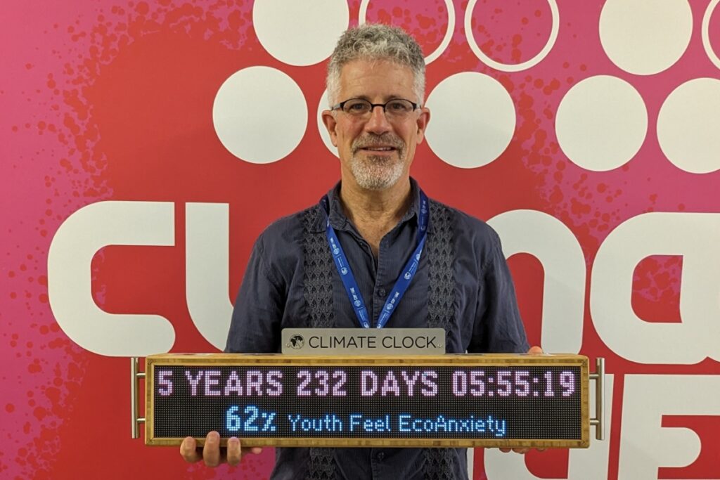 CCC Director Noah Horowitz with the Climate Clock, which shows the time left to limit global warming to 1.5C.
